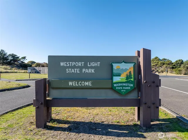 a view of a street with benches in the background