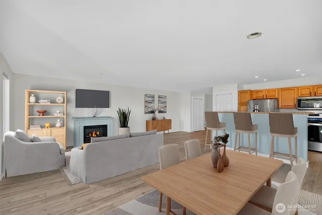 a living room with furniture and fireplace