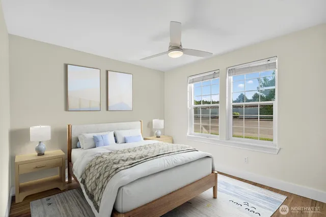 a bedroom with a large bed and a window