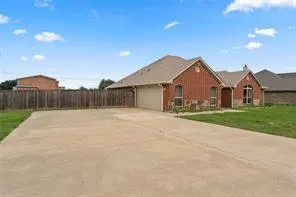 a front view of a house with yard