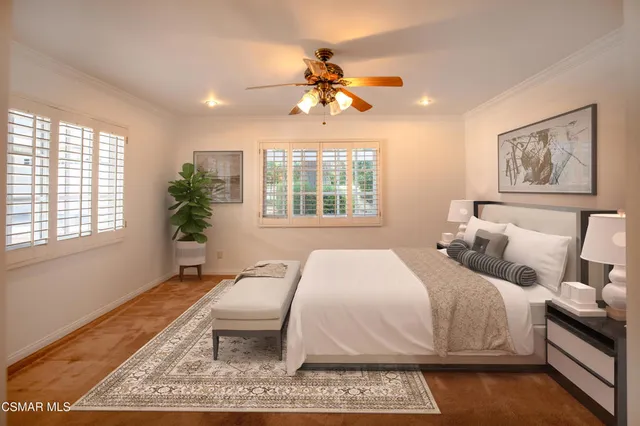 a spacious bedroom with a large bed and a window