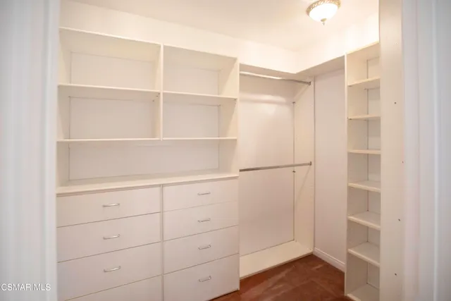 a view of an empty walk in closet