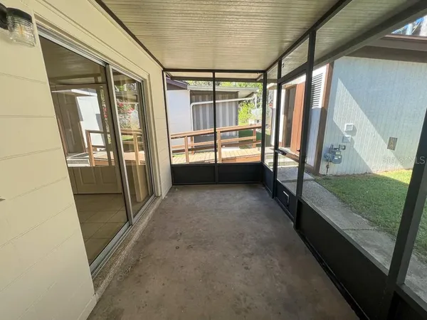 a view of balcony with wooden floor and iron stairs