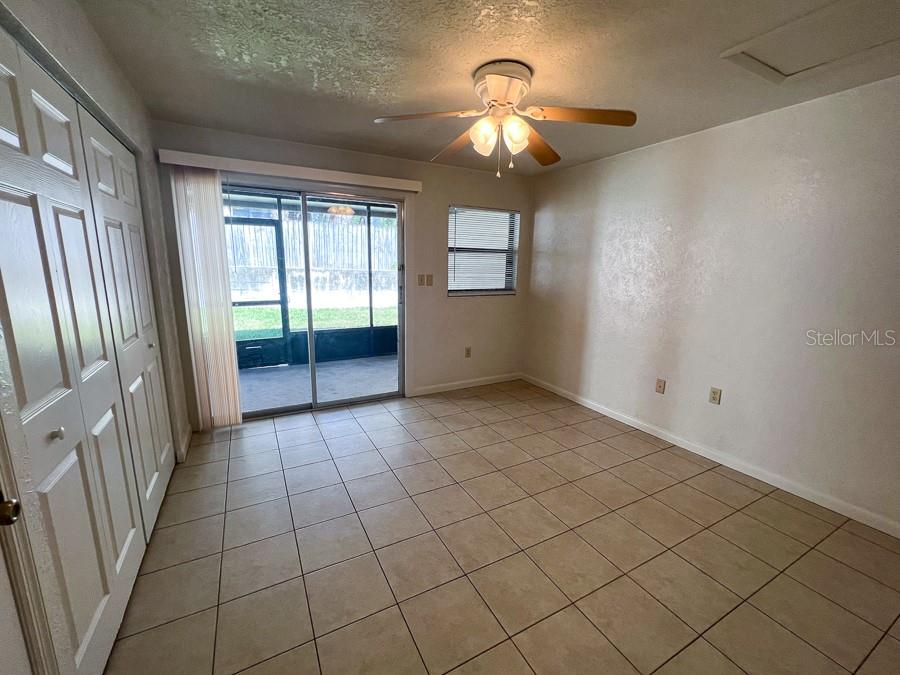 1406 Southwest 18th Place, Unit 11 Gainesville, FL 32608 - Photo 8 of 16 en empty room with windows