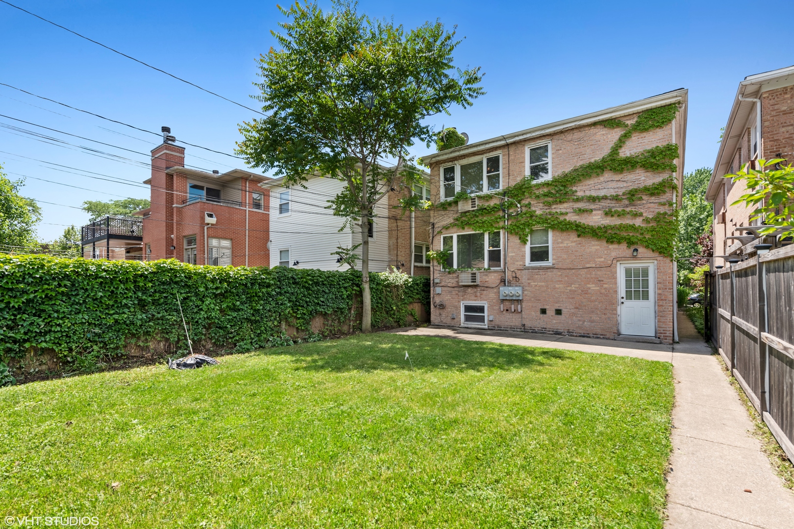 Undisclosed Address Chicago, IL 60641 - Photo 14 of 19 a front view of a house with a yard