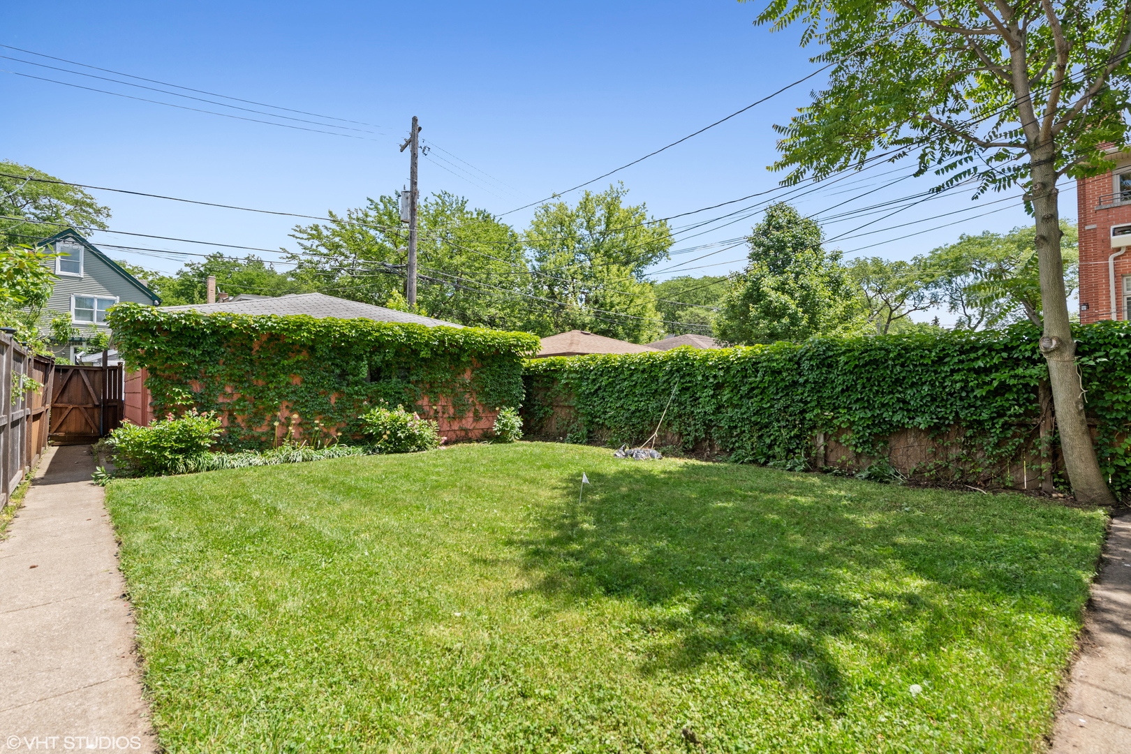 Undisclosed Address Chicago, IL 60641 - Photo 15 of 19 a front view of a house with garden