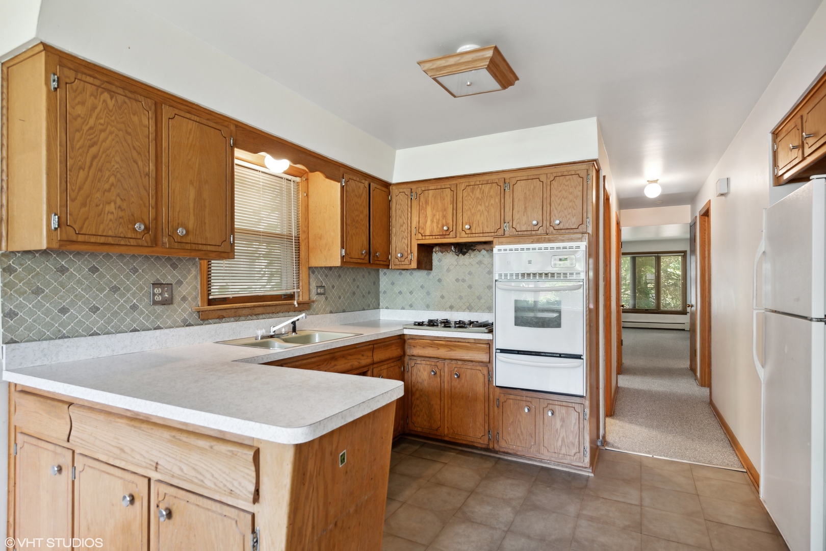 Undisclosed Address Chicago, IL 60641 - Photo 3 of 19 a kitchen with stainless steel appliances granite countertop a refrigerator sink and cabinets