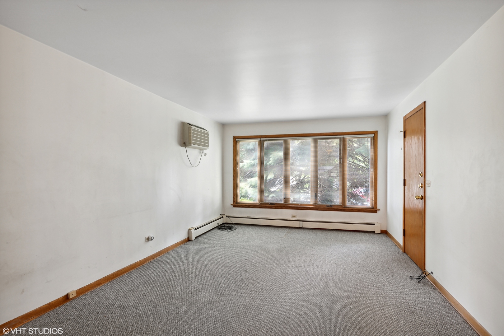 Undisclosed Address Chicago, IL 60641 - Photo 7 of 19 a view of an empty room with a window