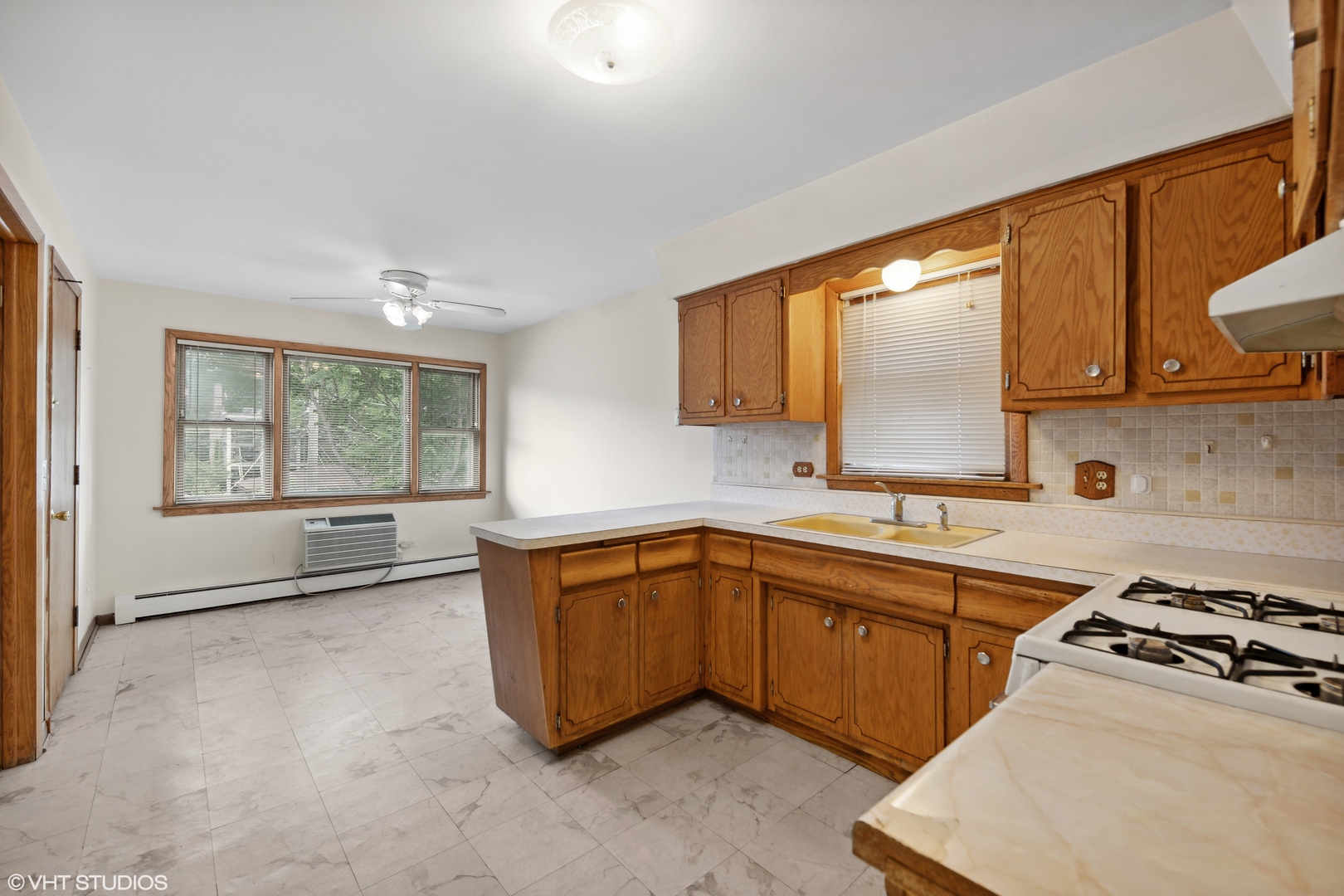 Undisclosed Address Chicago, IL 60641 - Photo 9 of 19 a kitchen with stainless steel appliances a sink stove and window