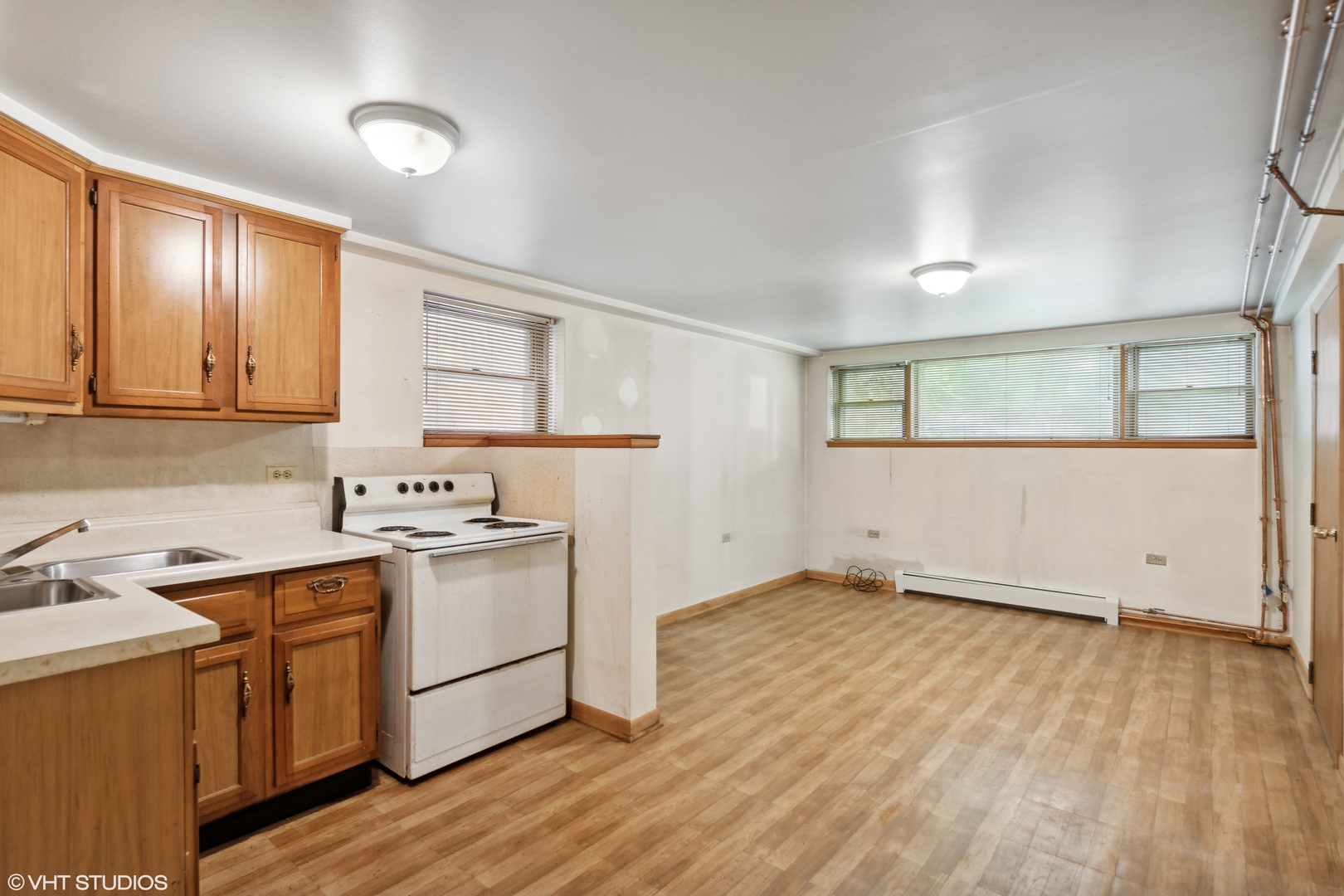 Undisclosed Address Chicago, IL 60641 - Photo 10 of 19 a kitchen with a sink cabinets and wooden floor