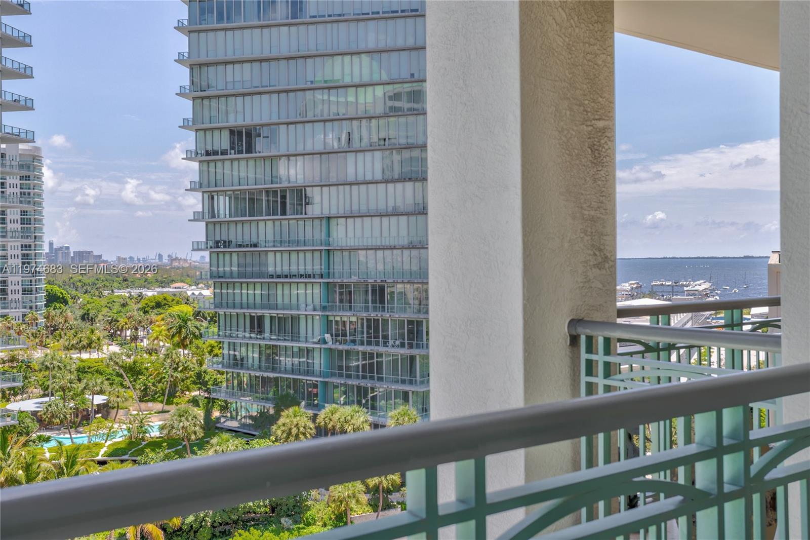 3400 Southwest 27th Avenue, Unit 906 Miami, FL 33133 - Photo 13 of 35 a view of a building from a balcony