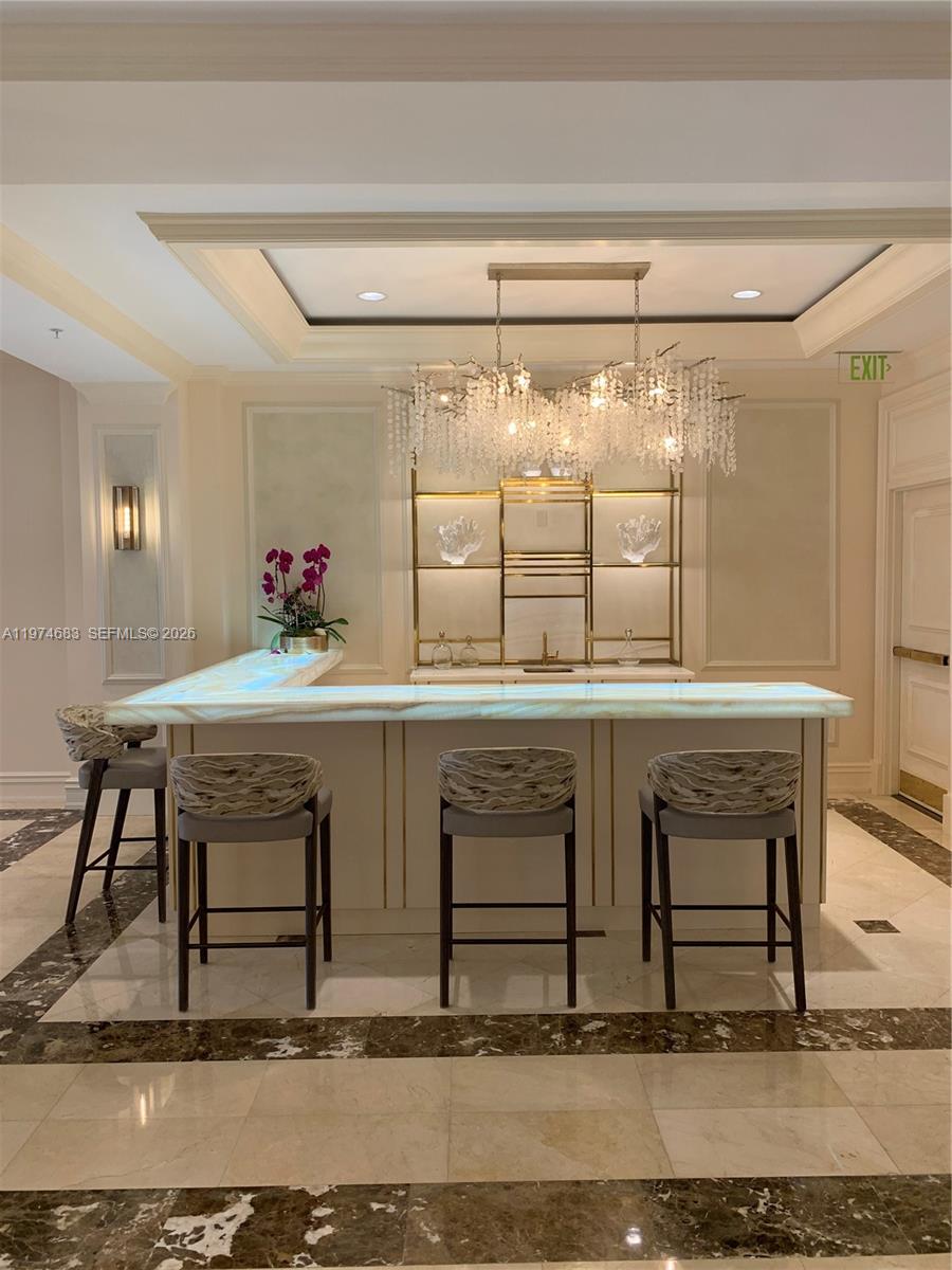 3400 Southwest 27th Avenue, Unit 906 Miami, FL 33133 - Photo 30 of 35 a view of hall with table and chairs