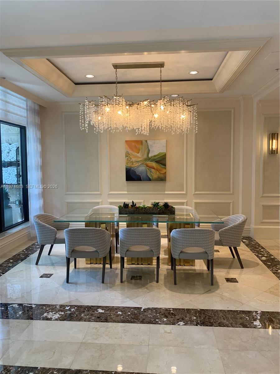 3400 Southwest 27th Avenue, Unit 906 Miami, FL 33133 - Photo 31 of 35 a living room with stainless steel appliances granite countertop a couch and chairs