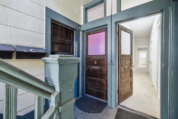 a view of an empty room and closet area