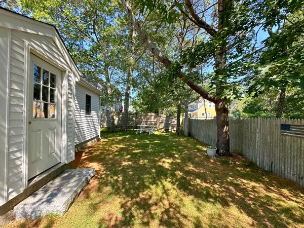 a view of backyard of the house