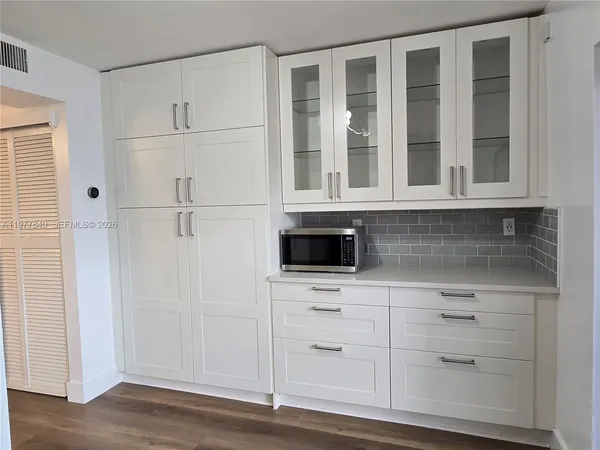 a view of cabinets and window