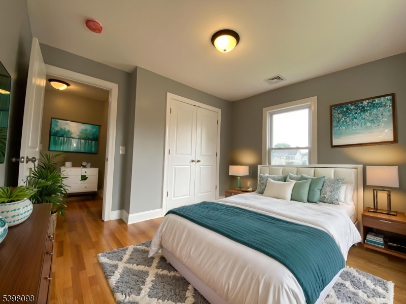 59 West Stewart Street Washington, NJ 07882 - Photo 13 of 22 a bedroom with a bed and a flat screen tv