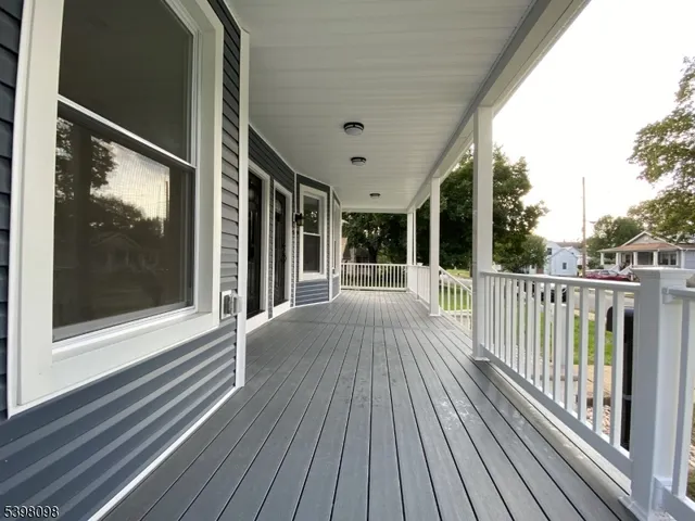 a view of a balcony with wooden floor