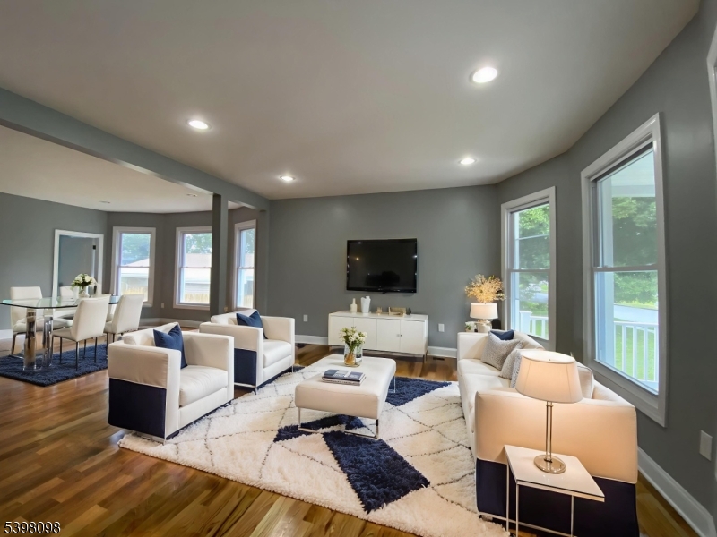 59 West Stewart Street Washington, NJ 07882 - Photo 4 of 22 a living room with furniture flat screen tv and a large window