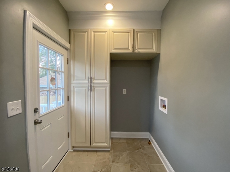 59 West Stewart Street Washington, NJ 07882 - Photo 8 of 22 an empty room with wooden floor and windows