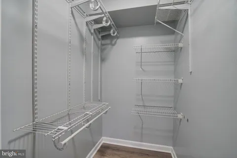 a view of storage and utility room with racks on the wall