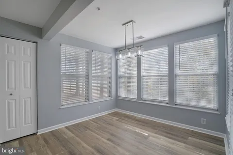 a view of an empty room with a fireplace