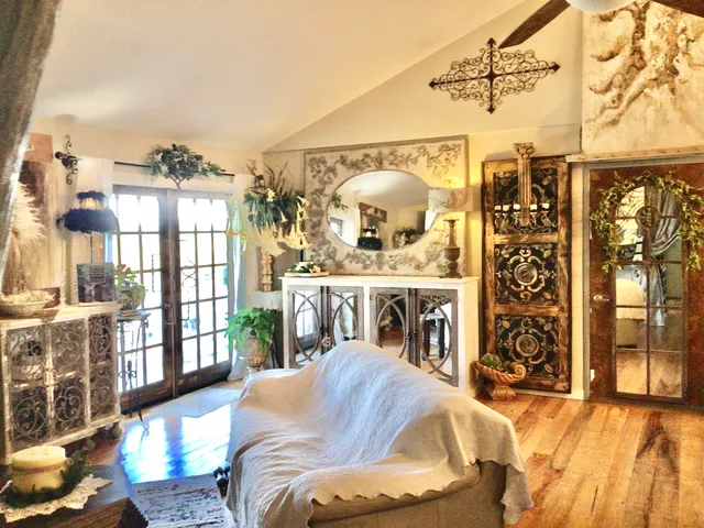 a dining room with furniture and wooden floor