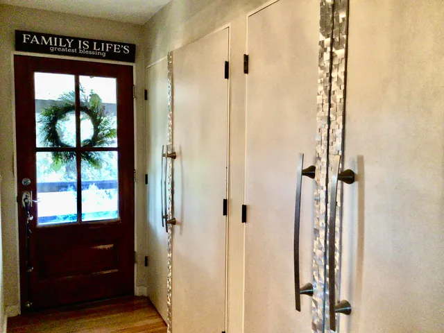 a view of a bathroom from a hallway