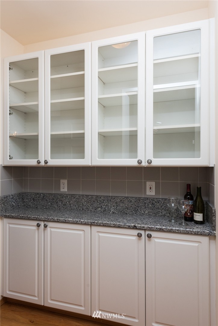 14419 152nd Place Southeast Renton, WA 98059 - Photo 13 of 25 a kitchen with granite countertop a oven a cabinets and a counter space