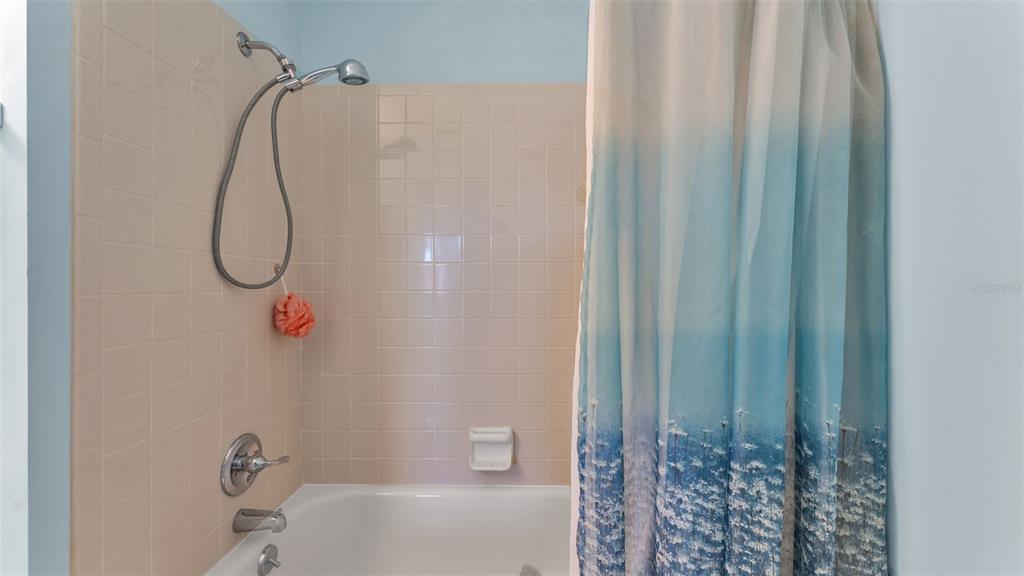 6051 Topher Trail, Unit 6051 Mulberry, FL 33860 - Photo 16 of 38 a bathroom with a shower