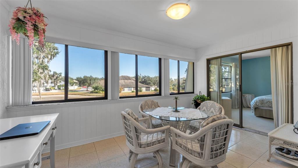 6051 Topher Trail, Unit 6051 Mulberry, FL 33860 - Photo 20 of 38 a dining room with furniture and window