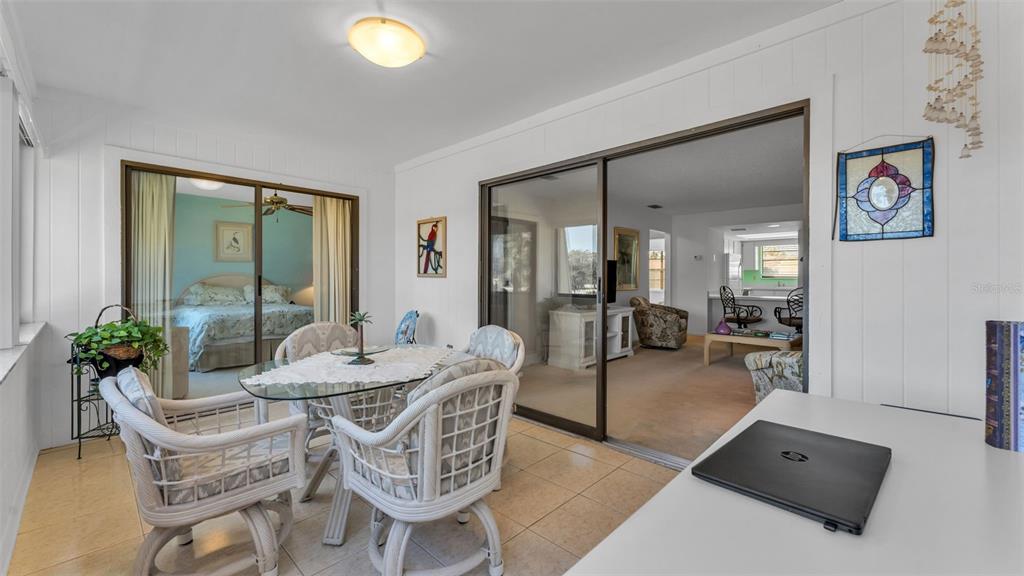 6051 Topher Trail, Unit 6051 Mulberry, FL 33860 - Photo 21 of 38 a dining room with furniture and wooden floor