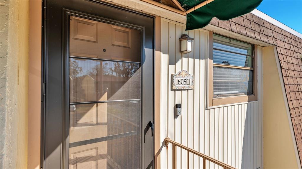 6051 Topher Trail, Unit 6051 Mulberry, FL 33860 - Photo 3 of 38 a view of a door and a window