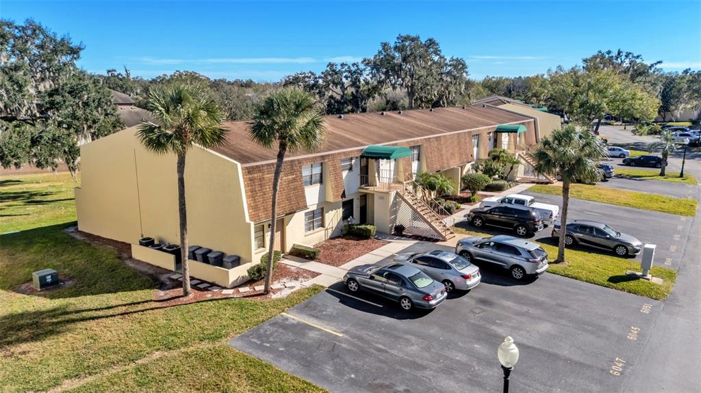 6051 Topher Trail, Unit 6051 Mulberry, FL 33860 - Photo 35 of 38 a view of a house with backyard space and sitting area