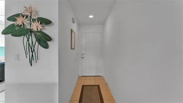 a glass door in a white room