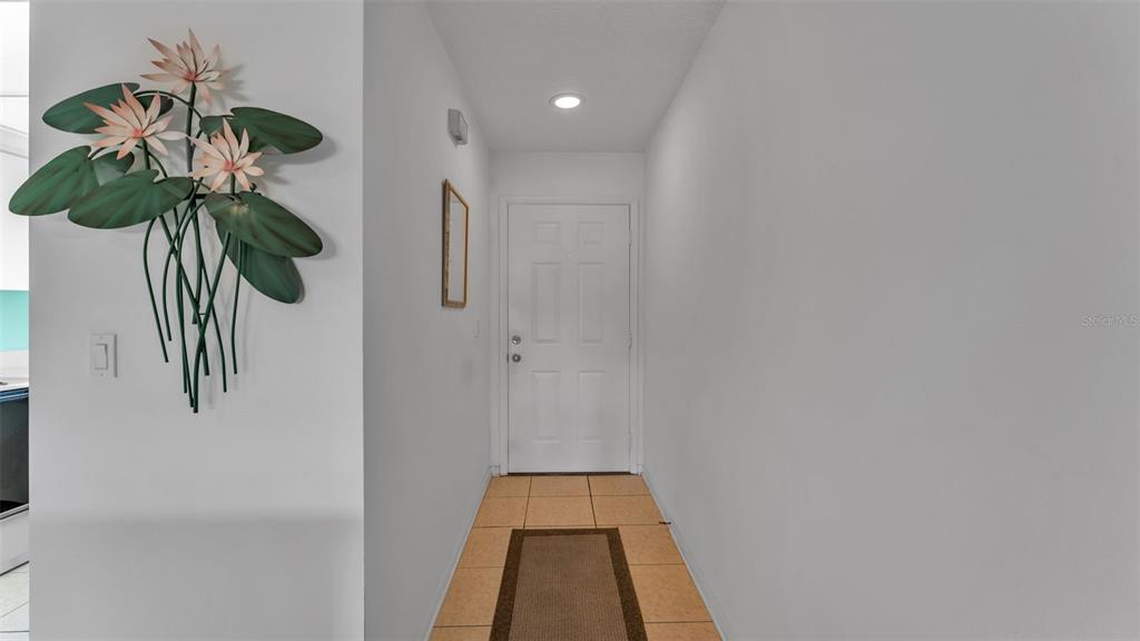 6051 Topher Trail, Unit 6051 Mulberry, FL 33860 - Photo 6 of 38 a glass door in a white room