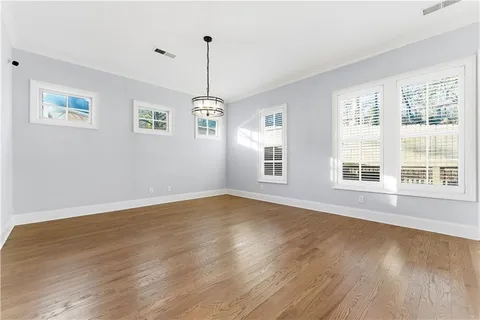 a view of an empty room with windows