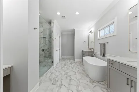 a spacious bathroom with a bathtub sink and toilet