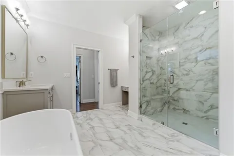 a bathroom with a bathtub and a shower