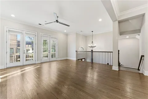 a view of an entryway with wooden floor