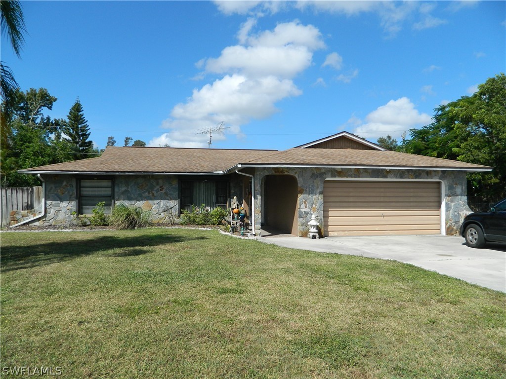17396 Oriole Road Fort Myers, FL 33967 - Photo 1 of 17 a view of a house with backyard and porch