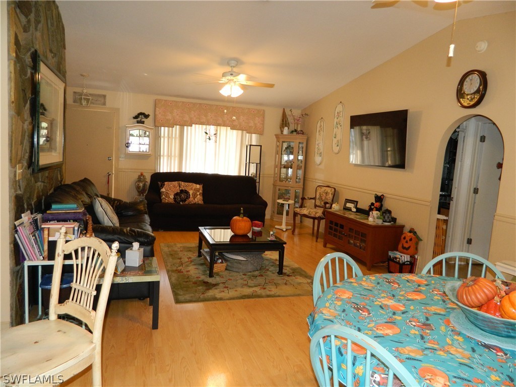 17396 Oriole Road Fort Myers, FL 33967 - Photo 3 of 17 a living room with furniture a flat screen tv and a couch