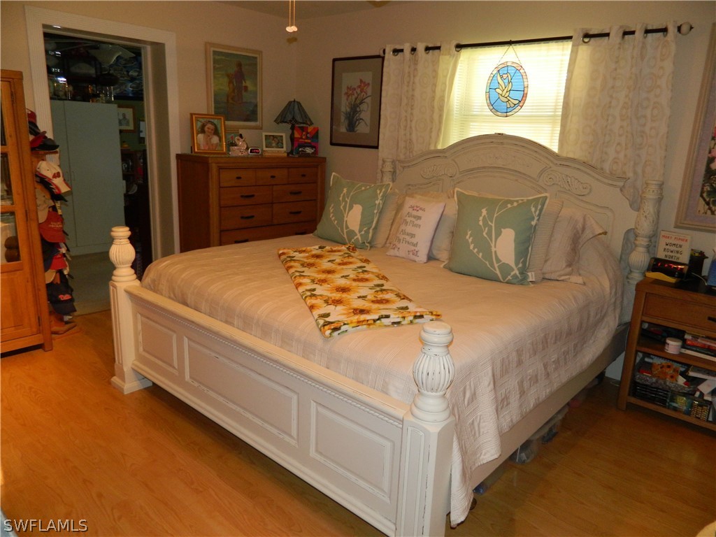 17396 Oriole Road Fort Myers, FL 33967 - Photo 6 of 17 a bedroom with a bed and a dresser