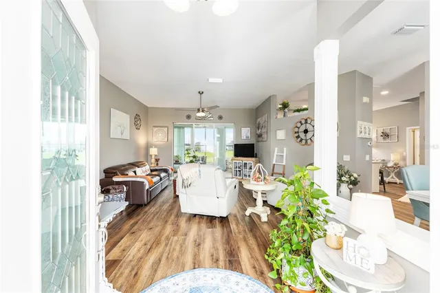 a view of a dining room with furniture window and wooden floor