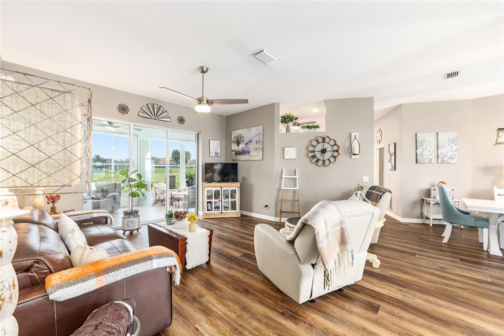 5719 Northwest 25th Loop Ocala, FL 34482 - Photo 19 of 67 a living room with furniture and a chandelier
