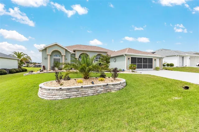 a front view of a house with a yard table and chairs