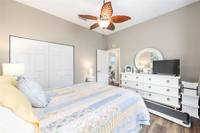 a bed room with furniture and a flat screen tv
