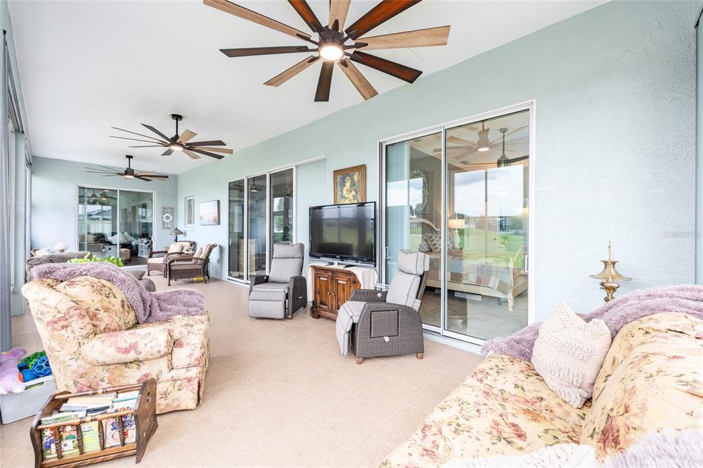 5719 Northwest 25th Loop Ocala, FL 34482 - Photo 48 of 67 a bed room with furniture and a flat screen tv