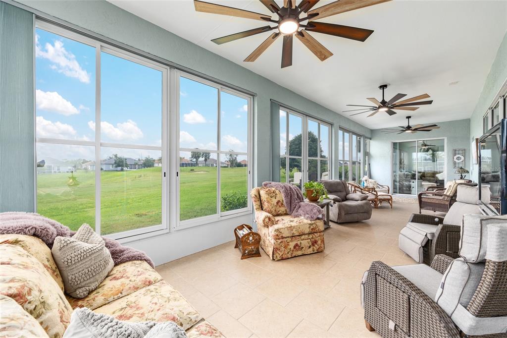 5719 Northwest 25th Loop Ocala, FL 34482 - Photo 49 of 67 a living room with furniture and a large window