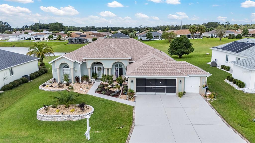 5719 Northwest 25th Loop Ocala, FL 34482 - Photo 51 of 67 a aerial view of a house with swimming pool garden and patio